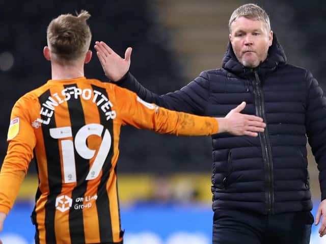 Hull City chief Grant McCann, right, hailed Keane Lewis-Potter's performance against Oxford United as "excellent". Pictures: Getty Images