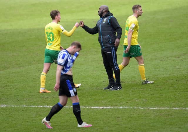 Sheffield Wednesday boss Darren Moore congratulates Norwich City's Kieran Dowell as Tom Lees walks off in despair.    Picture: Steve Ellis