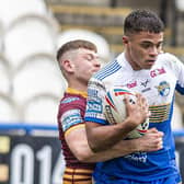 Gripped: Leeds 
Rhinos youngster Corey Hall is held.  Picture Tony Johnson