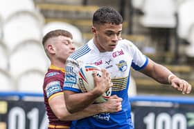 Gripped: Leeds Rhinos youngster Corey Hall is held.  Picture Tony Johnson