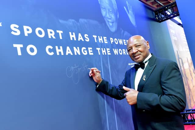 LEGEND: 'Marvelous' Marvin Hagler signs the Nelson Mandela wall during the 2019 Laureus World Sports Awards. Picture: Christian Alminana/Getty Images.