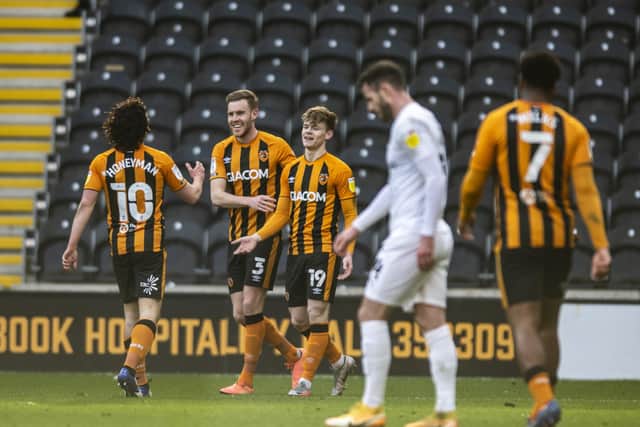 YOU'RE THE MAN: Hull City goalscorer Keane Lewis-Potter congratulated by Callum Elder and George Honeyman. Picture: Tony Johnson