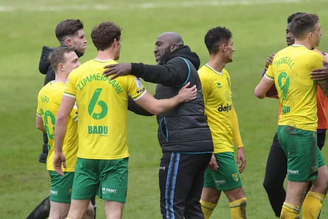 Sheffield Wednesday boss Darren Moore congratulates Norwich City's players after their 2-1 win at Hillsborough. Picture: Steve Ellis