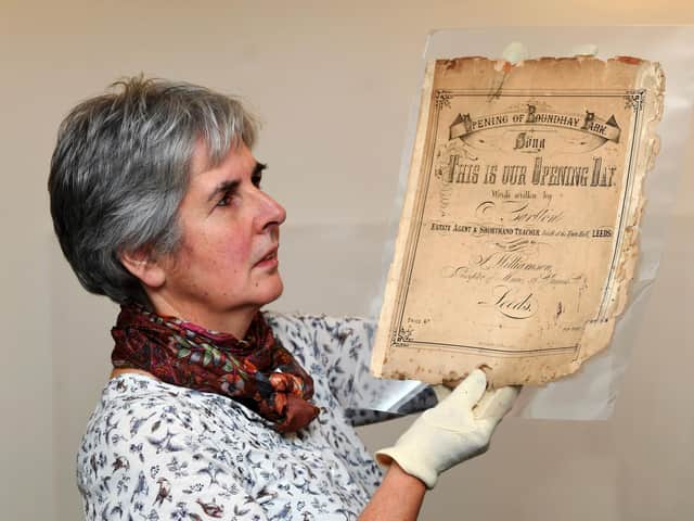 Museum curator Kitty Ross, pictured with sheet music from Leeds museums' Sounds of our City exhibition