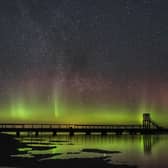 The Northern Lights above the Holy Island causeway and refuge hut