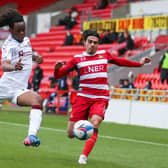 Doncaster Rovers' Reece James (right) and Northampton Town's Peter Kioso battle for the ball at the Keepmoat Stadium during Saturday's 0-0 draw.. Picture: Isaac Parkin/PA.