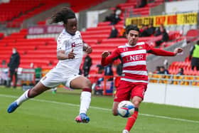 Doncaster Rovers' Reece James (right) and Northampton Town's Peter Kioso battle for the ball at the Keepmoat Stadium during Saturday's 0-0 draw.. Picture: Isaac Parkin/PA.