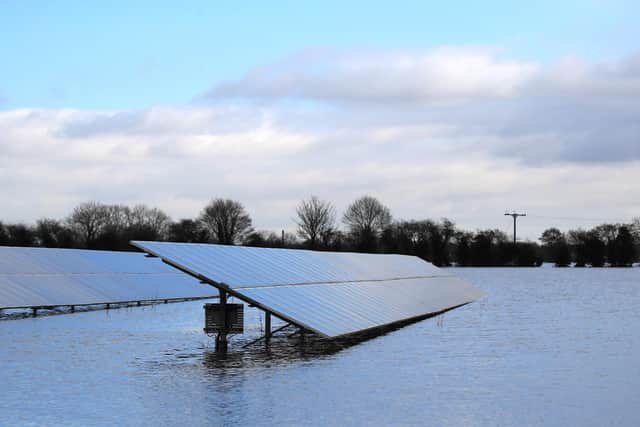 File photo of solar panels in floodwater in East Cowick,Yorkshire. Photo: PA
