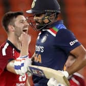England's Mark Wood, left, celebrates the wicket of India's KL Rahul, right, during the third Twenty20 cricket match between India and England at Narendra Modi Stadium in Ahmedabad, India, on Tuesday. Picture: AP Photo/Aijaz Rahi.
