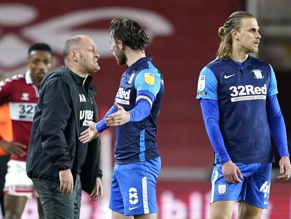 Preston midfielder Alan Browne pleads his innocence after his controversial red card at Middlesbrough, while manager Alex Neil looks furious. Picture: PA.