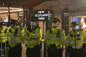 Police officers outside New Scotland Yard, central London, during a Reclaim the Streets protest in memory of Sarah Everard who went missing while walking home from a friend's flat on March 3.