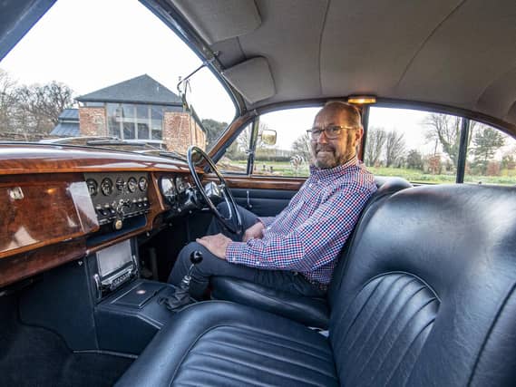 Yorkshire Post reader Jon Denton, from near Brigg in North Lincolnshire with the Jaguar car he had seen up for auction with Spicers highlighted in the paper. Picture Tony Johnson