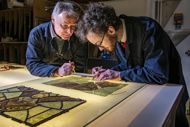 15th century stained glass from Thornhill Parish Church in Dewsbury being restored by expert Jonathan Cooke with his son Tristram in his workshop near Ilkley. Picture Tony Johnson