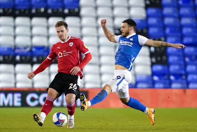 WISE HEAD: Barnsley's Michael Sollbauer, in action against Birmingham City's Scott Hogan. Picture: Zac Goodwin/PA