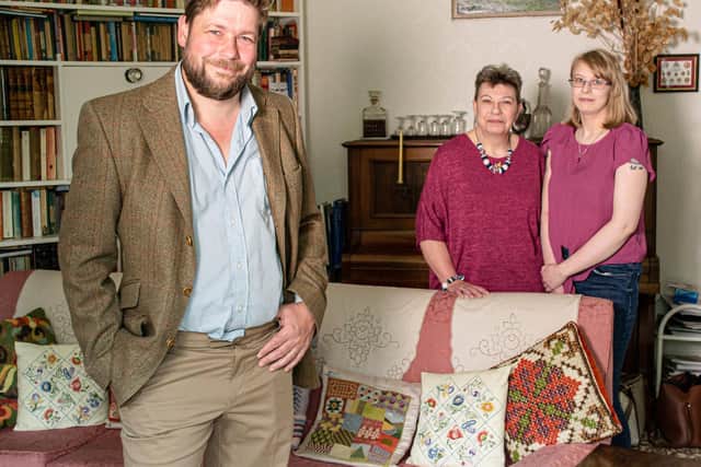 Angus Ashworth with  bereaved relatives during a house clearance