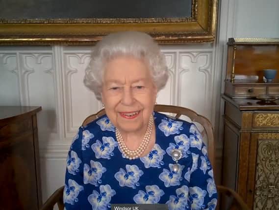 Queen Elizabeth II during a video call with the Duchess of Cornwall to thank volunteers from the Royal Voluntary Service (RVS)