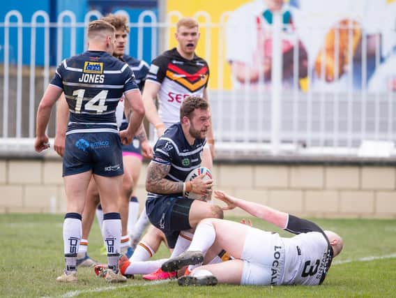 Featherstone Rovers' Thomas Minns scores against Bradford Bulls in the Challenge Cup yesterday. (ALLAN MCKENZIE/SWPIX)