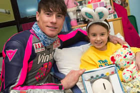 James Toseland delivers an Easter gift to Cooper Little after the Sheffield Egg Run in 2018