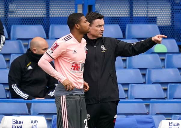 Sheffield United interim manager Paul Heckingbottom, right, gives instructions to Rhian Brewster at Stamford Bridge. Picture: John Walton/PA