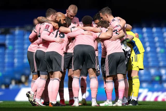 REST AND RECOVERY: Sheffield United players during a huddle prior to kick-off against Chelsea at Stamford Bridge on Sunday. Picture: John Walton/PA