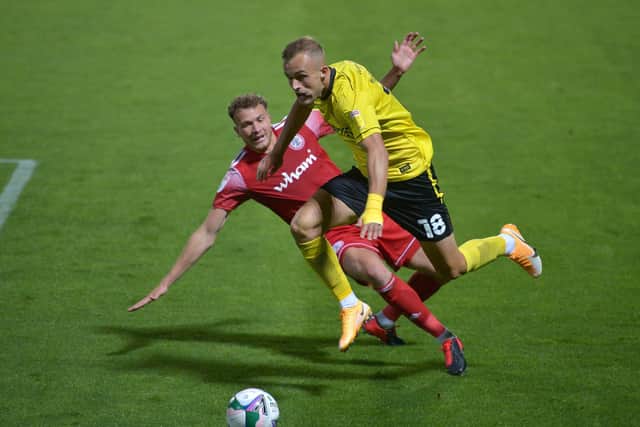 FORMER CLUB: Charles Vernam in action for Burton earlier this season. Picture: Jacob King/PA