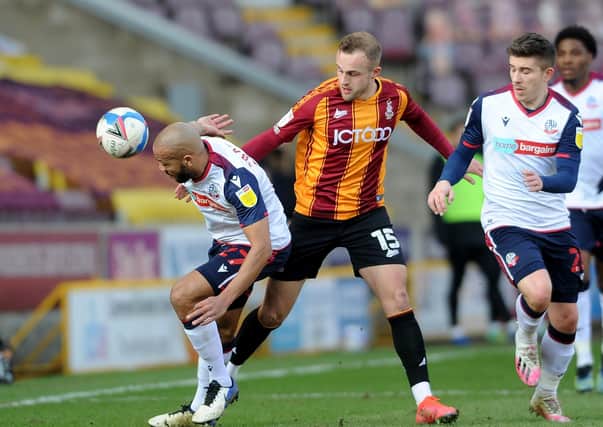 Bradford City's Charles Vernam battles with Bolton's Alex Baptiste earlier this month at Valley Parade. Picture: Simon Hulme