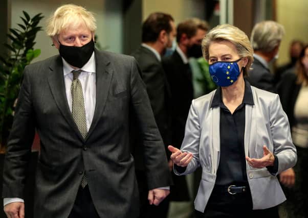 Boris Johnson with European Commission President Ursula von der Leyen  in the Berlaymont building at the EU headquarters in Brussels on December 9, 2020 (Photo by OLIVIER HOSLET/POOL/AFP via Getty Images)