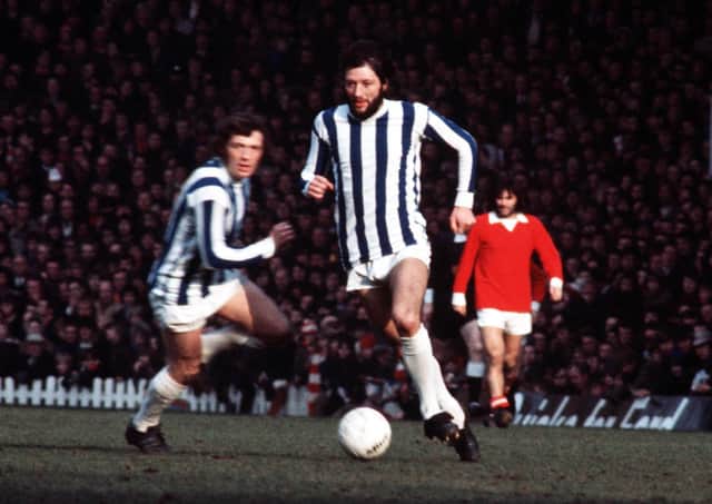 flamboyant: Frank Worthington leaves the legendary George Best in the background in this Old Trafford First Division encounter between  Manchester United and Huddersfield Town in 1972. Picture: Bob Thomas/Getty Images