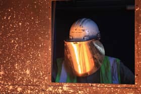 A worker tends to the furnace producing ferrotitanium during a visit to Tivac Alloys by UKIP leader Nigel Farage to see first hand how the global steel crisis is affecting small businesses on April 18, 2016. Pic by Getty Images.