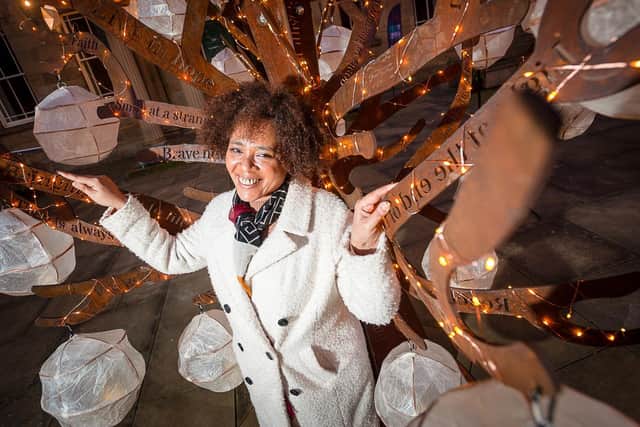 Pictured, poet Michelle Scally Clarke who recited the poem, `Love and Light', in front of a new metal tree sculpture with paper lanterns hanging from branches, engraved with words of hope, unveiled in Huddersfield last night. Photo credit: Huddersfield Literature Festival