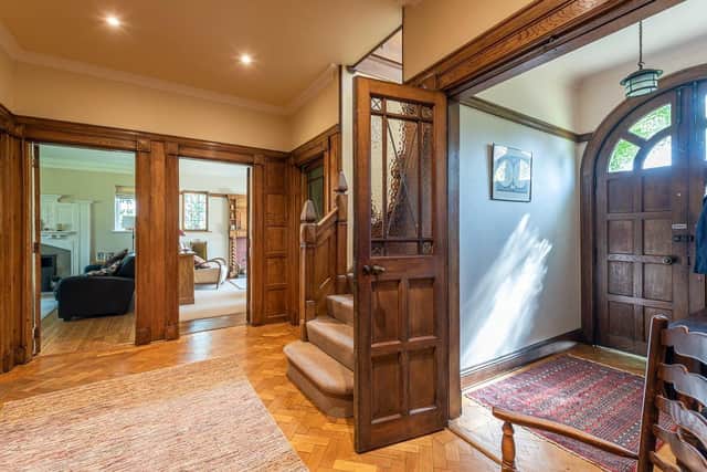 The house features original carved panelling, parquet flooring, and period fire places in both Arts and Crafts and Art Deco styles.