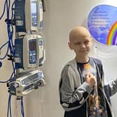 Tyler Dunn, nine, ringing the bell at the end of his cancer treatment for a brain tumour