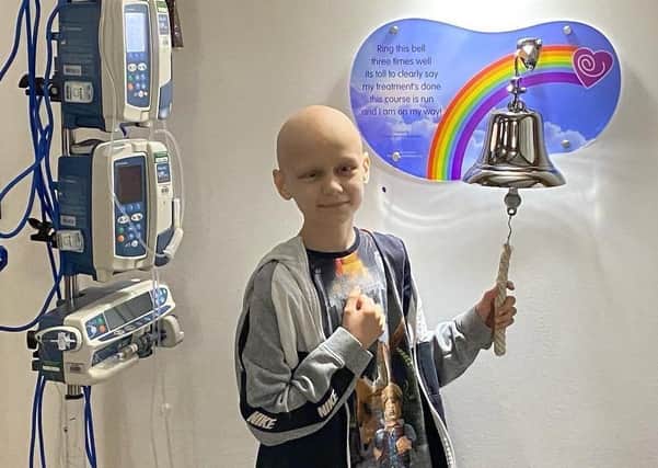 Tyler Dunn, nine, ringing the bell at the end of his cancer treatment for a brain tumour