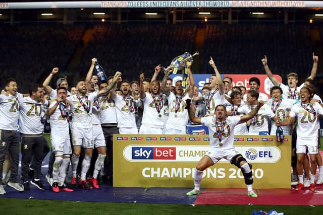 Wish you were here: Leeds United lift the Sky Bet Championship trophy at an empty Elland Road. Picture: PA