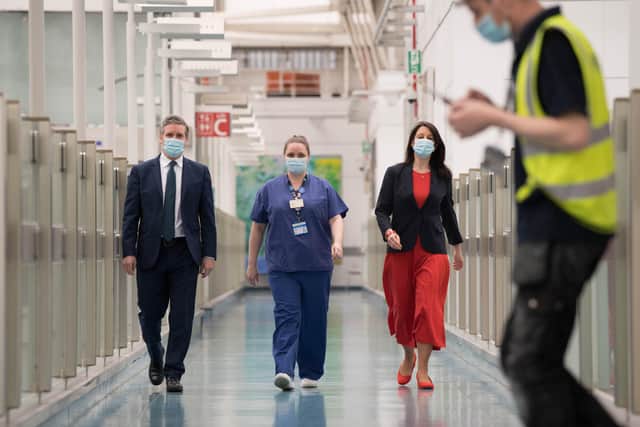 Labour party leader Sir Keir Starmer and Shadow Chancellor of the Duchy of Lancaster, Rachel Reeves meet staff during a visit to Chelsea and Westminster Hospital, London, to thank the NHS staff for their work as the country marks the one year anniversary of the first national lockdown.