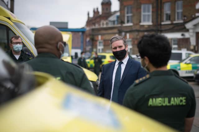 Labour leader Keir Starmer joins paramedics at Deptford Ambulance station, south-east London, to observe a minute's silence in memory of the lives lost to COVID-19 during the National Day of Reflection on the anniversary of the first national lockdown.