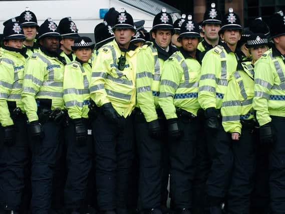 Police form a line around the English Defence League in City Square, Leeds, 
in October 2009. Picture: Jonathan Gawthorpe