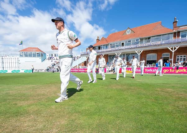 Yorkshire's Steve Patterson leads his side out against Surrey at Scarborough's North Marine Road ground. Picture: swpix.com
