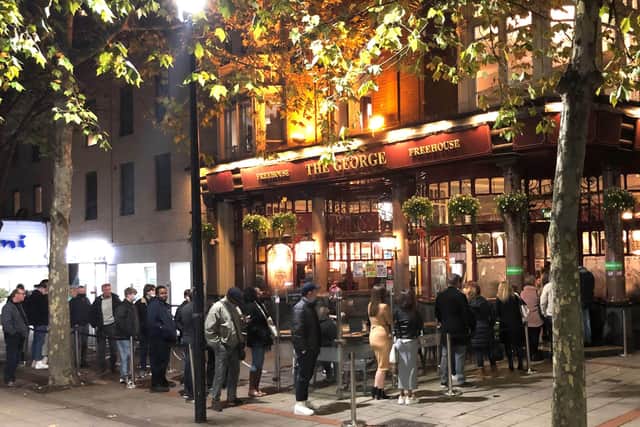 People queuing to get into the The George pub in Wanstead, east London in 2020. Pub landlords could be allowed to require customers to provide proof they are vaccinated against coronavirus, according to Boris Johnson. Picture: Stefan Rousseau/PA Wire