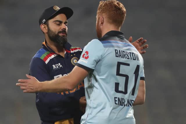 India's captain Virat Kohli, left, congratulates England's Jonny Bairstow on their win after the second One Day International cricket match. (AP Photo/Rafiq Maqbool)