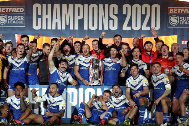 St Helens celebrate with the trophy after winning the Betfred Super League Grand Final at the KCOM Stadium, Hull.  Picture Martin Rickett/PA Wire.