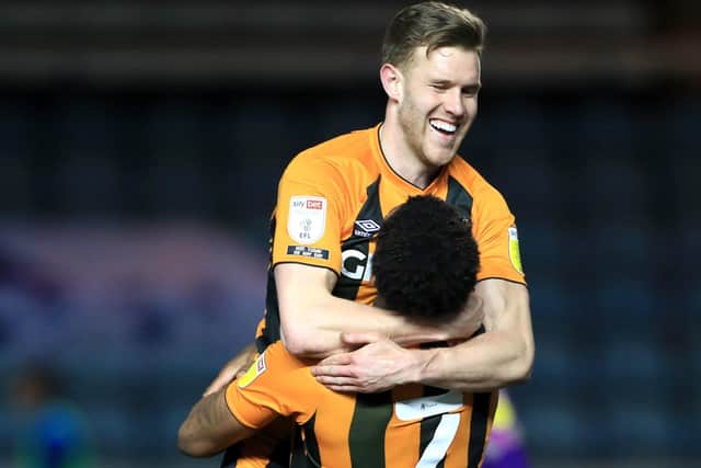 On their way back?: Callum Elder celebrates with Hull City team-mate Mallik Wilks (right), as the Tigers sit top of League One. Picture: PA