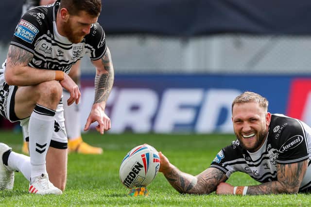 Hull FC's Josh Griffin holds the ball for Marc Sneyd.  (ALLAN MCKENZIE/SWPIX)