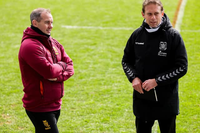 Hull FC head coach Brett Hodgson and Huddersfield head coach Ian Watson.