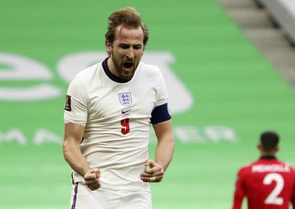 England's Harry Kane celebrates his side's first goal during the World Cup 2022 group I qualifying soccer match between Albania and England at Air Albania stadium in Tirana. (AP Photo/Hektor Pustina)