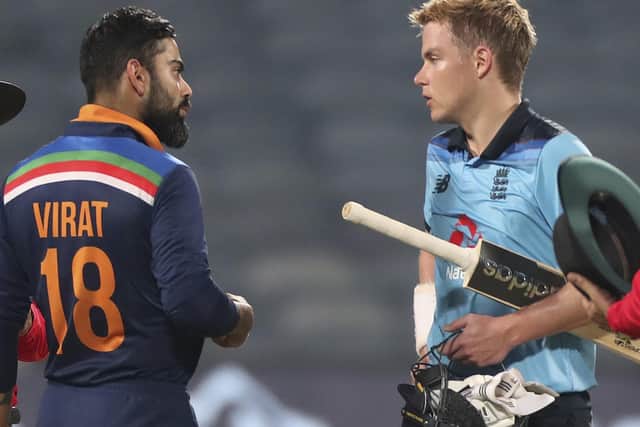 India's captain Virat Kohli, left, interacts with England's Sam Curran at the end of the third One Day International cricket match between India and England (AP Photo/Rafiq Maqbool)
