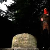 Simon Ahaimi from York Dungeon dressed as Dick Turpin in St George's Graveyard in York where the grave of Richard Turpin lies.