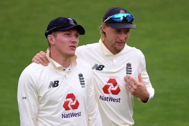 England's Joe Root (right) and Dom Bess (Picture: PA)