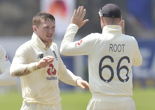Dom Bess celebrates a wicket with Joe Root on day four of the second Test match between Sri Lanka and England at Galle (Picture: Sri Lanka cricket via ECB)