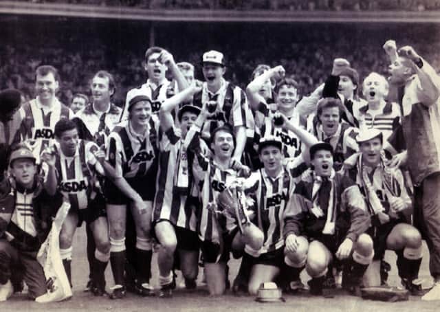 CUP UPSET: A jubilant Sheffield Wednesday team after beating Manchester United 1-0 at Wembley in the Rumbelows League Cup Final - April, 21 1991. Wednesday went on to win promotion at the end of the season 1990-91 season. Picture: Nancy Fielder/PA.